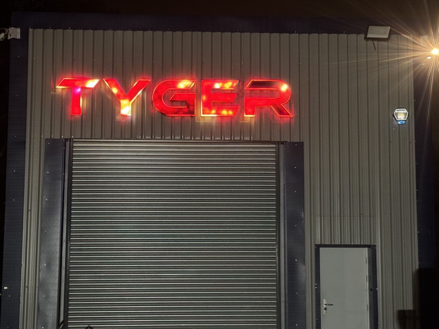 Tyger Security premises lit at night